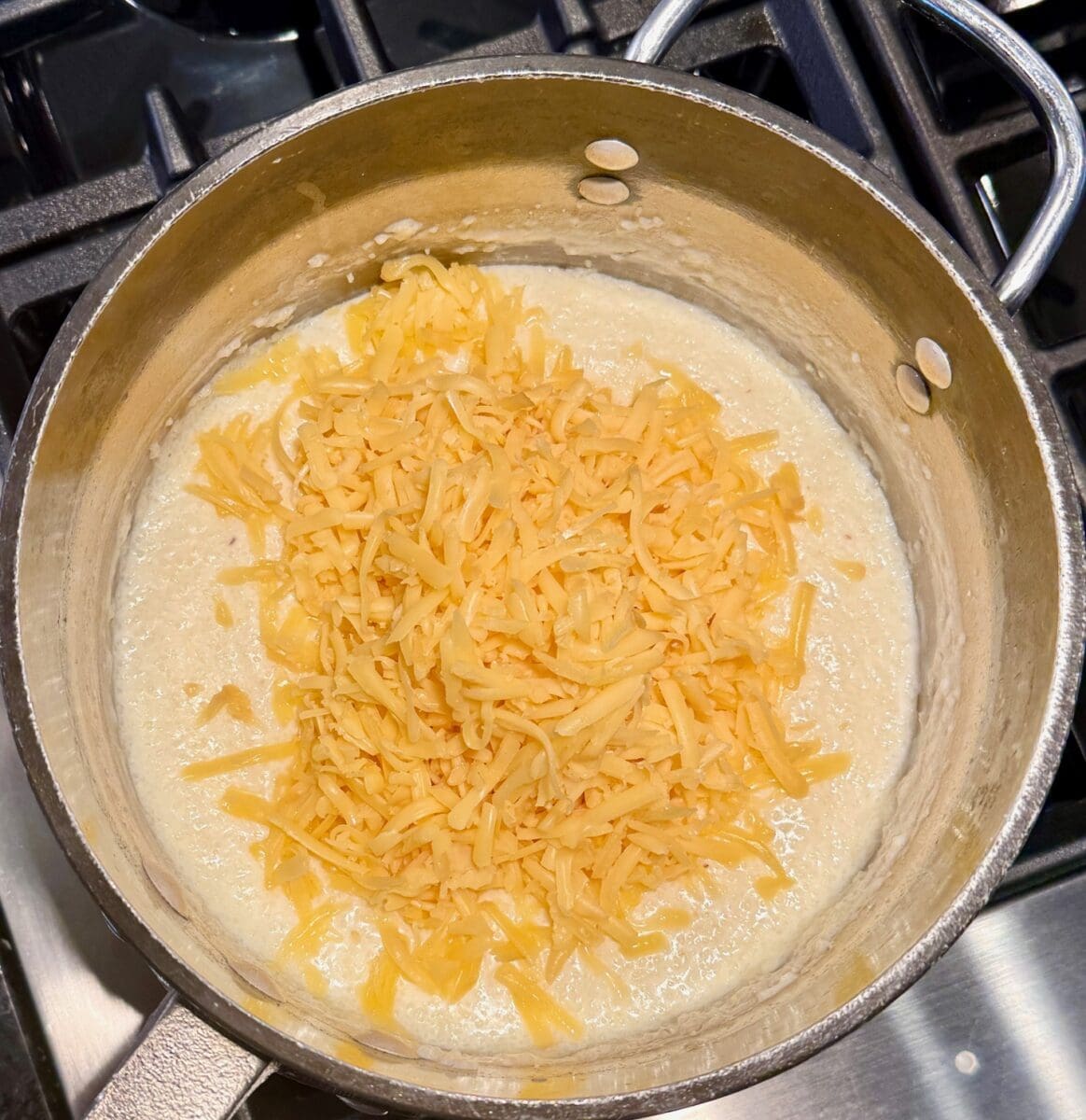 adding grated cheese