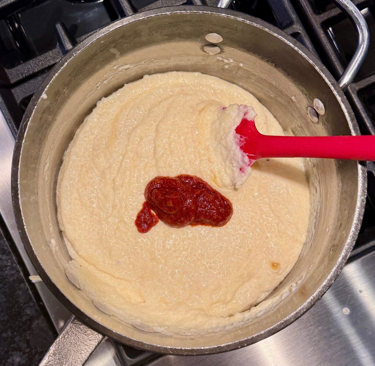 adding seasoning to grits