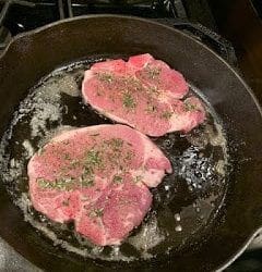 herbed Pork chops frying