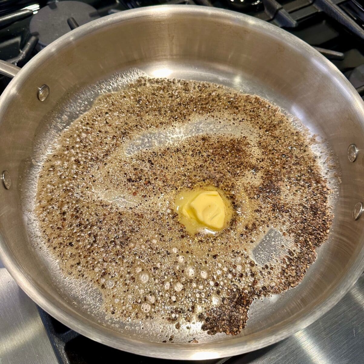 melting butter into pepper