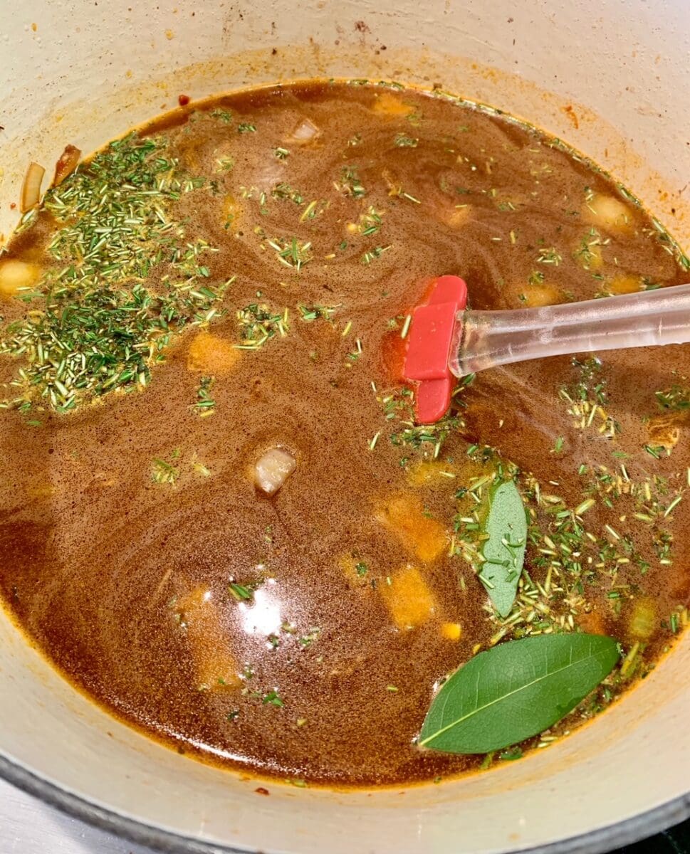 adding seasoning and broth