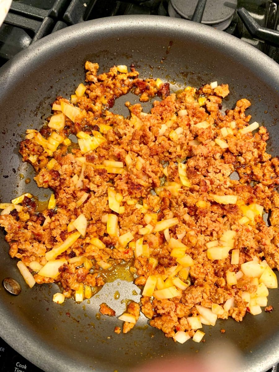 frying chorizo and onions